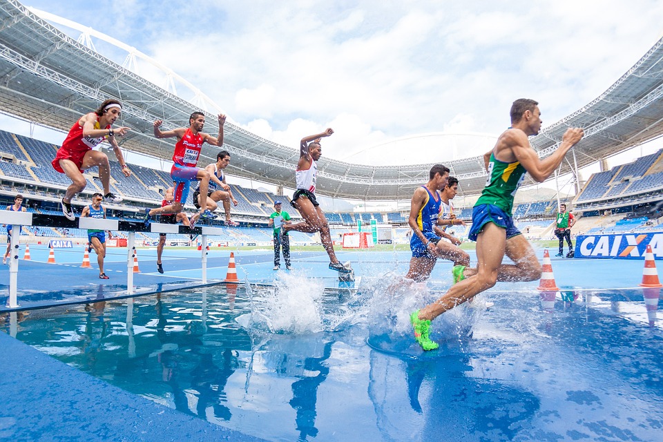 athletes jumping on water