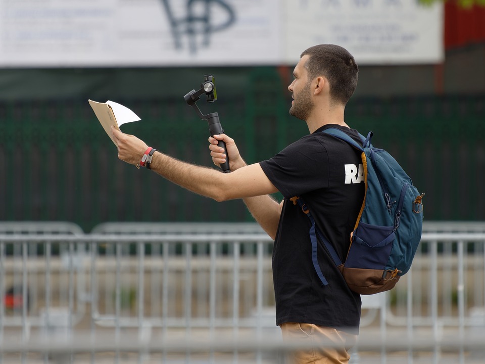 guy vlogging on the street