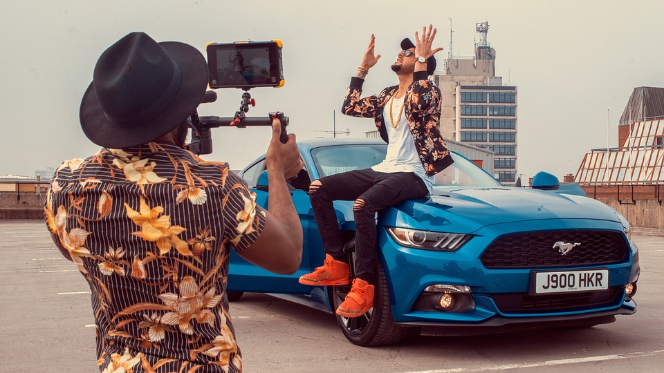 shooting a video guy on a car